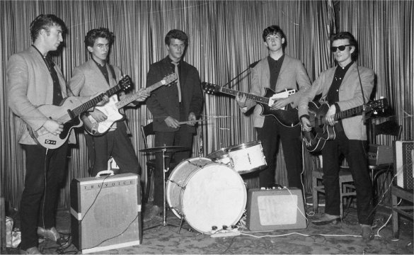 The Beatles posing onstage at the Indra Club in Hamburg. Original source: The Beatles Bible, www.beatlesbible.com/1960/08/17/live-indra-club-hamburg/.